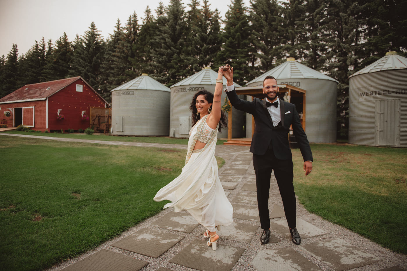 Indian wedding photography Edmonton — barn couple dancing